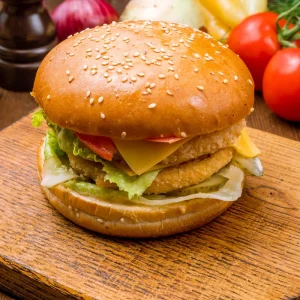 Veggie Burger - Flavorful Veggie Patty with Fresh Tomato, Crisp Lettuce, Red Onion, and Burger Sauce